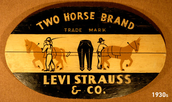 The LS&Co. two horse pull logo in the 1930s. Text reads "Two horse brand trade mark" above an illustration of two men directing two horses attempting to pull apart a pair of pants in the middle. "Levi Strauss & Co." is written at the bottom.