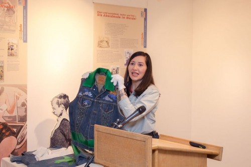 Me holding up an embellished vest designed for Justin Timberlake in 2001.
