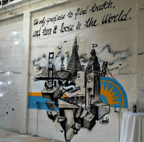 A mural of the organization's motto on the untouched wall of the new Commonwealth Club building.